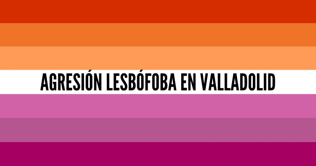 Bandera representativa del colectivo lésbico con el texto "agresión lesbófoba en Valladolid" escrito en la franja blanca central, denunciando un ataque violento.